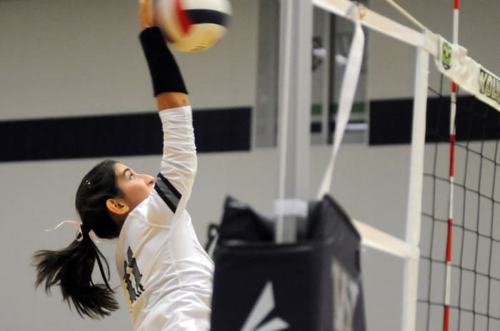 Lake Nona's Emma Gongora goes for one of her match-high 18 kills in a 17-25, 25-22, 25-19, 25-22 victory over Windermere on Thursday.